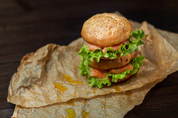 Homemade Burger with salmon on parchment