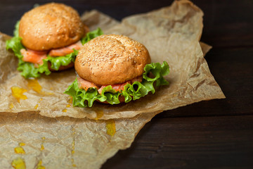 Homemade Burger with salmon on parchment