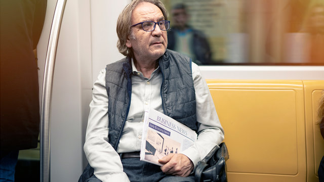 Man in the metro train - Powered by Adobe