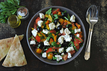 Middle Eastern salad with olives, feta and parsley. Healthy colorful vegetarian salad. Fresh arabic salad. Keto diet.
