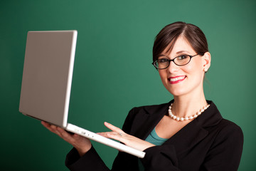 Happy Businesswoman Holding Laptop Computer - Business Concept
