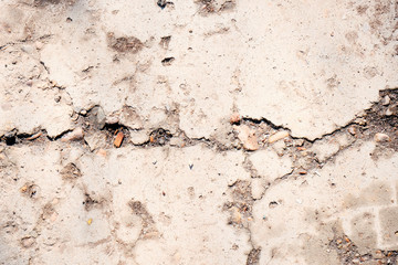 Pale blue stone texture of the wall. White paint stain on the surface. Copyspace.