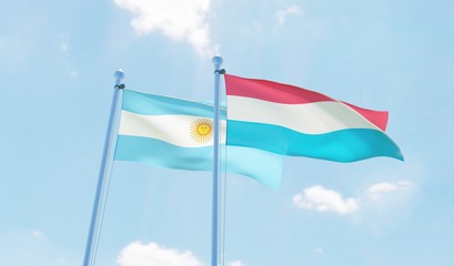 Argentina and Luxembourg, two flags waving against blue sky. 3d image