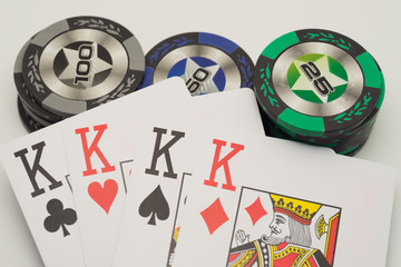 four kings and many color poker chips