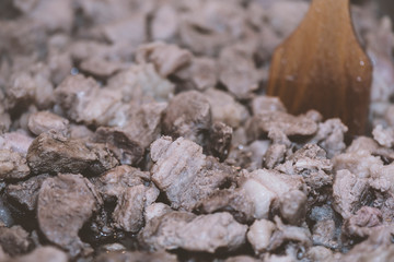 Preparation of home-made pork stew, cooking process in a pan, close-up