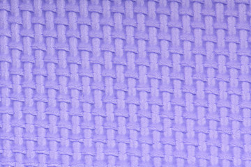 Texture of a polyethylene violet shine gym mat. Yoga mat texture.