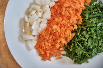 Chopped Onions, Carrots and Beans on a Plate