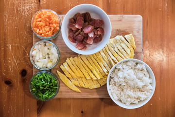 Ingredients for Fried Rice - Pork Sausages, Carrots, Beans, Rice and Omelette.
