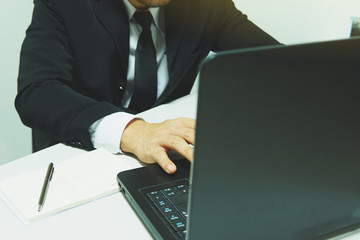 Midsection Of Businessman Using Laptop At Office