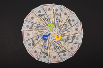 Question mark on mandala kaleidoscope from money.