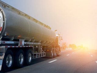Naklejka na ściany i meble Gas or oil Truck on highway road container, transportation concept.,import,export logistic industrial Transporting Land transport on the asphalt expressway