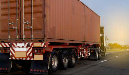 Naklejka na ściany i meble Truck on highway road with red container, transportation concept.,import,export logistic industrial Transporting Land transport on the asphalt expressway with blue sky