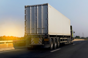 White Truck on highway road with  container, transportation concept.,import,export logistic industrial Transporting Land transport on the asphalt expressway