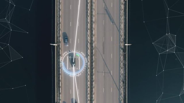 4k aerial view of self driving autopilot cars driving on a highway with technology tracking them, showing speed and who is controlling the car. Visual effects clip shot.