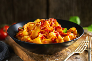 Tasty italian pizza with tomato sauce and parmesan