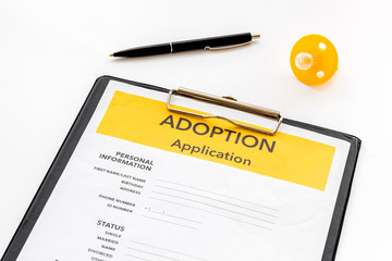 Application to adopt child with dummy on white background