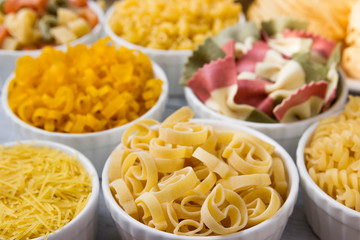 Different of types and shapes of dry Italian  of pasta.