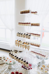 Sweet desserts on a festive buffet. Desserts for the holiday. Sweets at the restaurant.
