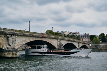 ship sails under the bridge