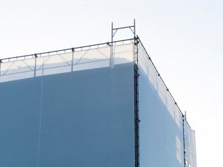 covered scaffholding protects a building under restoration