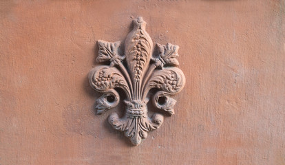 lily symbol of Florence in relief on a old terracotta tile - 260390393