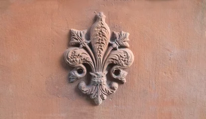 Foto op Canvas lily symbol of Florence in relief on a old terracotta tile © lucag_g
