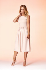 Beauty woman model wear stylish design trend clothing natural organic wool cotton dress casual formal office style for work meeting walk party blond hair makeup sexy pretty lady.