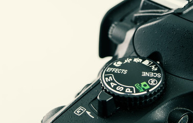 DSLR camera dial close-up. that shows the shooting mode dial