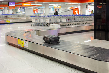 Lost luggage at the airport. Baggage sorting - Luggage on conveyor.