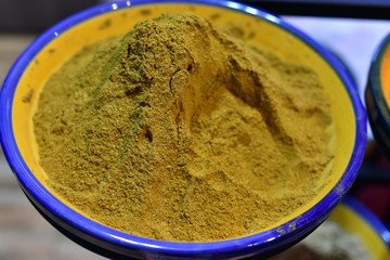 Heap of curry powder in a bowl, Cordoba Spice Market, Spain