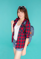 Beautiful portrait young asian woman wear sunglasses on head smile confident and excited summer holiday isolated blue background, model girl fashion having backpack, travel concept.