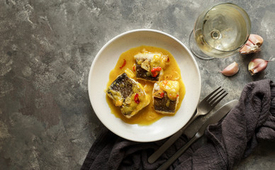 bacalao al pil pil, salted cod in emulsified olive oil sauce, spanish cuisine, basque country