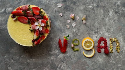 raw vegan cakes with fruit and seeds, decorated with flower, product photography for patisserie