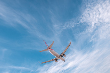 Naklejka na ściany i meble Plane in the sky. Aviation, travel air transportation concept