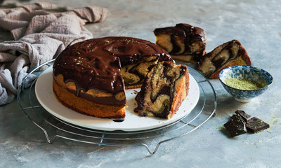 matcha green tea and chocolate cake. top view, copy space, grey background