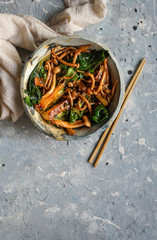 Bok choy o pak choi cabbage with shimeji mushrooms and Oyster sauce, garlic, typical asian japanese food, top view, flat lay, copy space