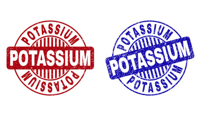 Grunge POTASSIUM round stamp seals isolated on a white background. Round seals with grunge texture in red and blue colors. Vector rubber imitation of POTASSIUM caption inside circle form with stripes.
