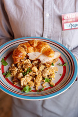 Lush croissant with chicken, soft cream cheese and scramble
