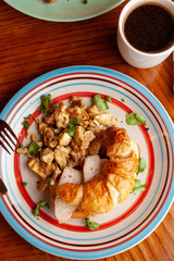 Lush croissant with chicken, soft cream cheese and scramble