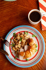 Lush croissant with chicken, soft cream cheese and scramble