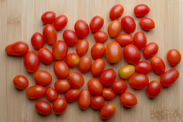 Red ripe tomatoes on wooden table