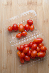 Red ripe tomatoes on wooden table