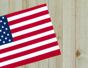a small American flag on a wood background with copy space