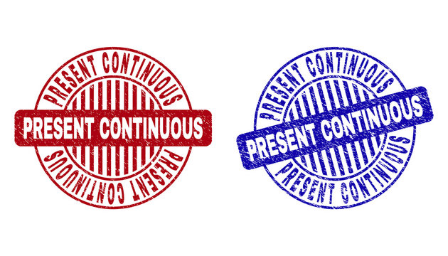 Grunge PRESENT CONTINUOUS round stamp seals isolated on a white background. Round seals with grunge texture in red and blue colors.