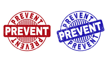 Grunge PREVENT round stamp seals isolated on a white background. Round seals with grunge texture in red and blue colors. Vector rubber imitation of PREVENT label inside circle form with stripes.