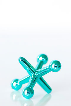 Single toy jack on white surface with copy space