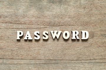 Letter block in word password on wood background