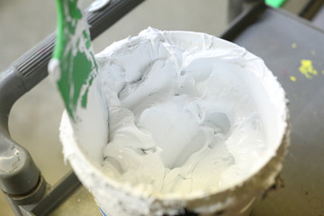 white screen print ink in a bucket