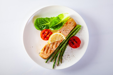 Roasted salmon steak with asparagos tomatoes  with fresh vegetable.