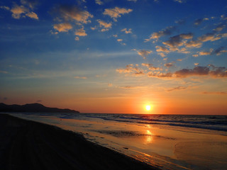 Fototapeta na wymiar Beautiful sunset view with vivid colors sky blue above.